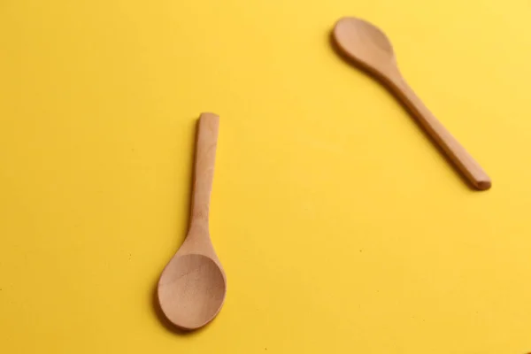 Wooden Kitchen Spoons Yellow Surface — Stock Photo, Image