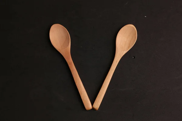 Top View Two Small Wooden Spoons Black Background — Stock Photo, Image