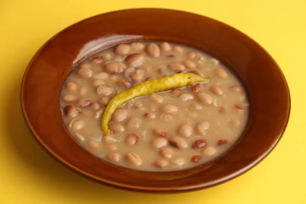 stock image A closeup shot of a plate of red beans with chili pepper, typical Spanish dish