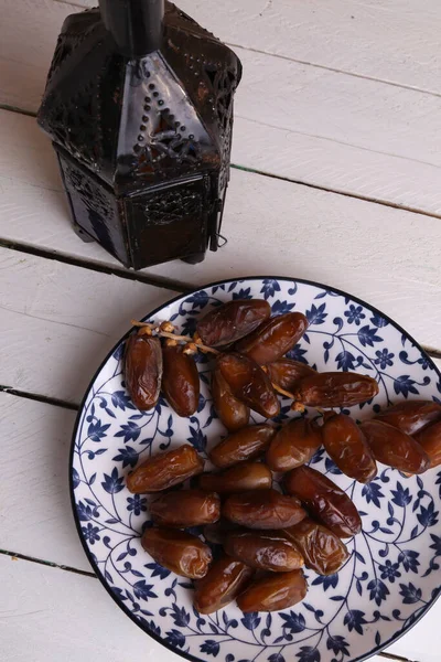 Vertical High Angle Shot Dried Dates Nice Plate Lantern Wooden — Stock Photo, Image