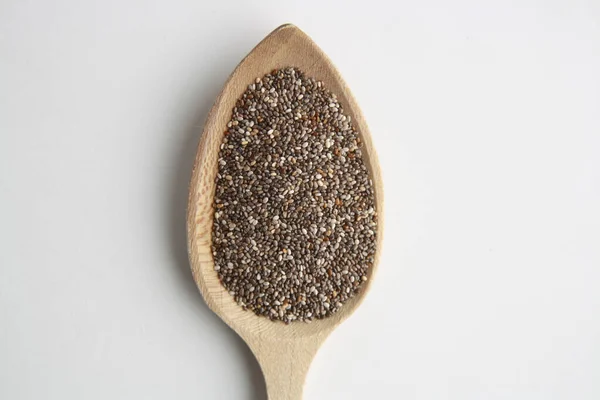 High Angle Closeup Shot Black Chia Seeds Wooden Spoon White — Stock Photo, Image
