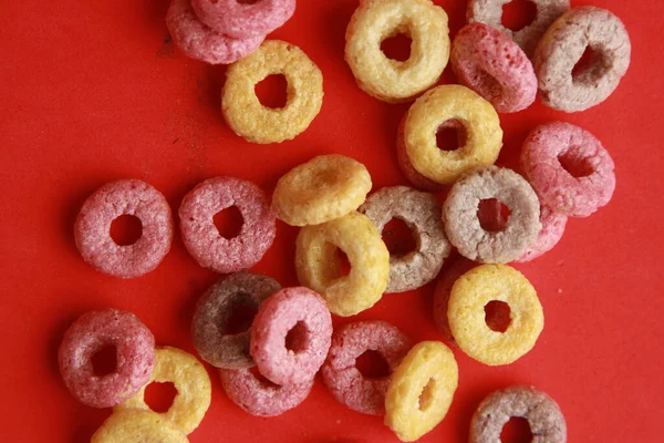 Closeup Shot Colorful Cereals Red Background — Stock Photo, Image