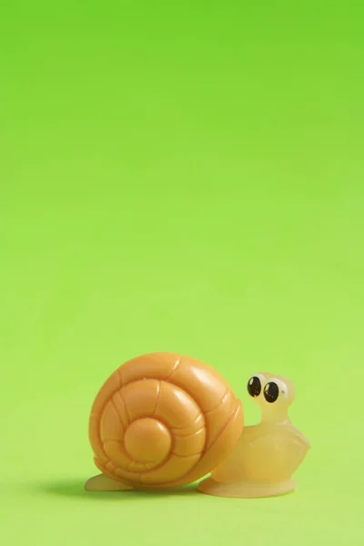 Closeup Shot Snail Toy Isolated Green Background — Stock Photo, Image