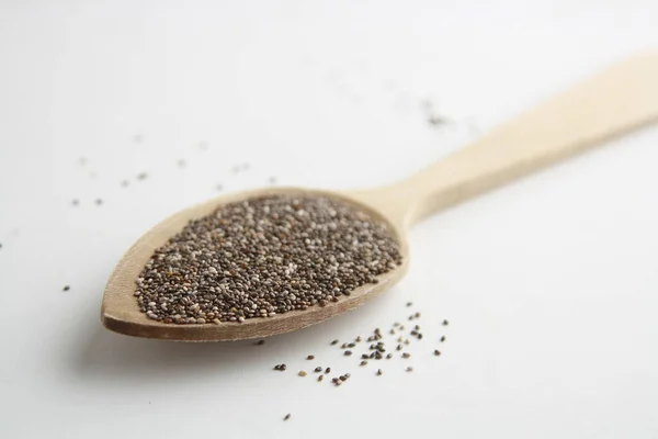High Angle Closeup Shot Black Chia Seeds Wooden Spoon White — Stock Photo, Image