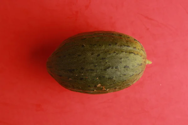 Organic Melon Isolated Red Background — Stock Photo, Image