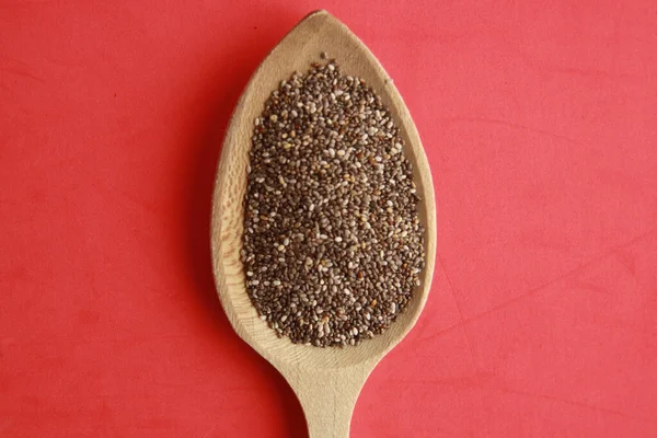 High Angle Closeup Shot Black Chia Seeds Wooden Spoon Red — Stock Photo, Image