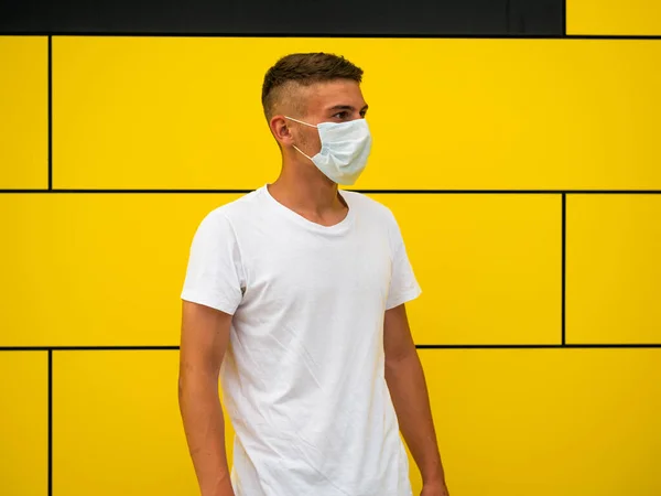 Caucasian Male Mask Standing Yellow Wall Background — Stock Photo, Image