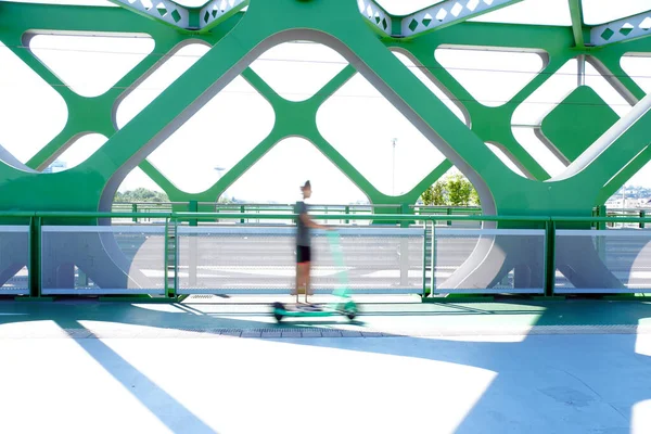 Blurred Shot Person Riding Scooter Green Railroad — Stock Photo, Image