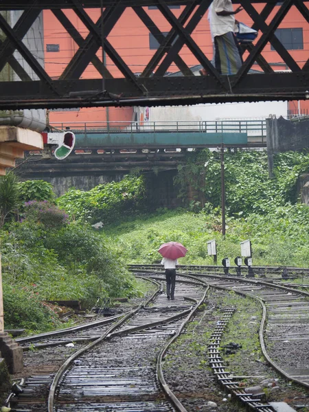 Vertical Shot Person Holding Umbrella Walking Railway Rain — Stock Photo, Image