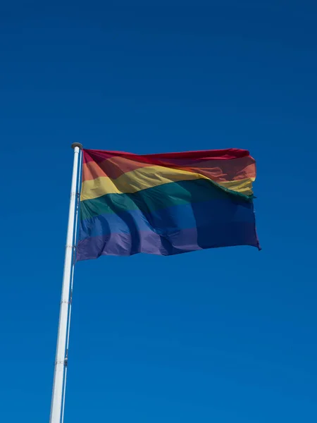 Vertical Shot Waving Lgbt Pride Flag Rainbow Flag Blue Sky — Stock Photo, Image