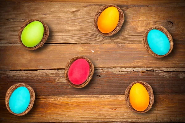 High Angle Shot Colorful Easter Eggs Bird Nests Wooden Surface — Stock Photo, Image