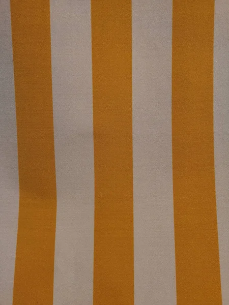 Lähikuva Pystysuora Laukaus Keltainen Valkoinen Raidallinen Kangas — kuvapankkivalokuva