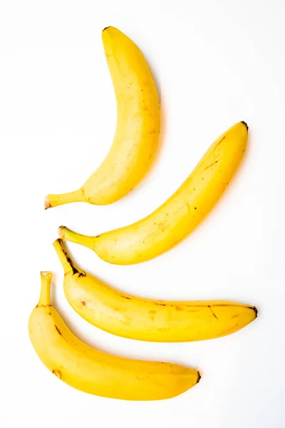 Cuatro Plátanos Aislados Sobre Fondo Blanco — Foto de Stock