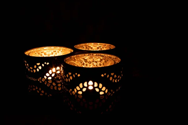 Closeup Three Ornamental Candles Burning Dark — Stock Photo, Image