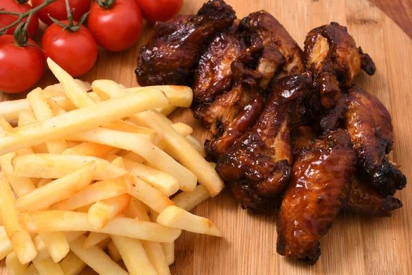 High Angle Shot French Fries Wooden Board Cherry Tomatoes Roasted — Stock Photo, Image