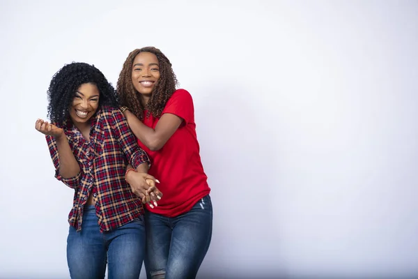 Two Pretty Young Black Female Friends Holding Each Other Laughing — Stock Photo, Image