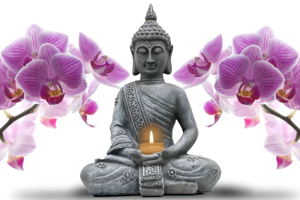 A Buddhist statue holding a candle with orchids on each side on a white background