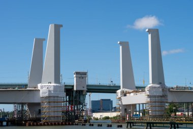 GOTHENBURG, SWEDEN - Aug 04, 2020: Construction of a new bridge between Gothenburg and Hisingen over Gota alv. Four giant pylons have just been assembled. clipart