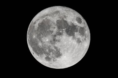 An amazing shot of the full moon on a dark night sky clipart