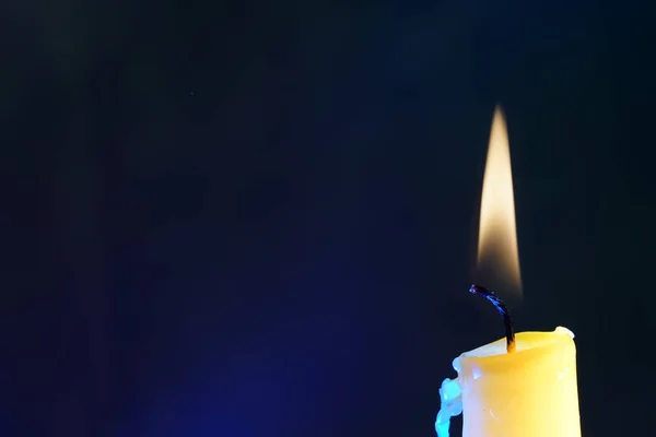 Closeup Shot Burning Candle Blue Background — Stock Photo, Image