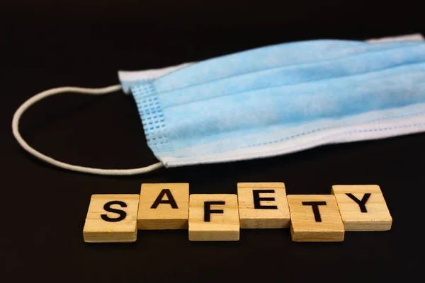 Face Mask Word Safety Spelled Out Wooden Blocks Black Background — Stock Photo, Image