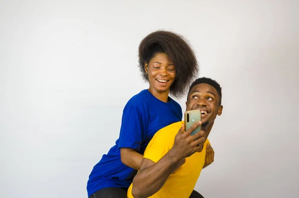 Cute Young African Couple Looking Phone Smiling Boyfriend Carrying His — Stock Photo, Image
