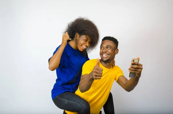 Cute Young African Couple Looking Phone Smiling Boyfriend Carrying Girlfriend — Stock Photo, Image