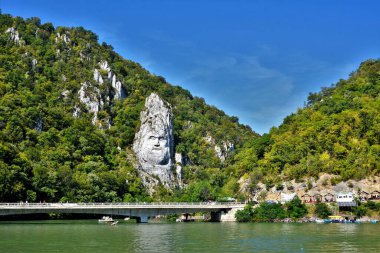 ORSOVA, ROMANIA - Sep 04, 2016: the statue of Decebalus on the bank of the Danube river - Romania clipart