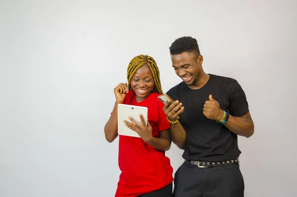 Cute African Couple Looking Phone Tablet Smiling — Stock Photo, Image
