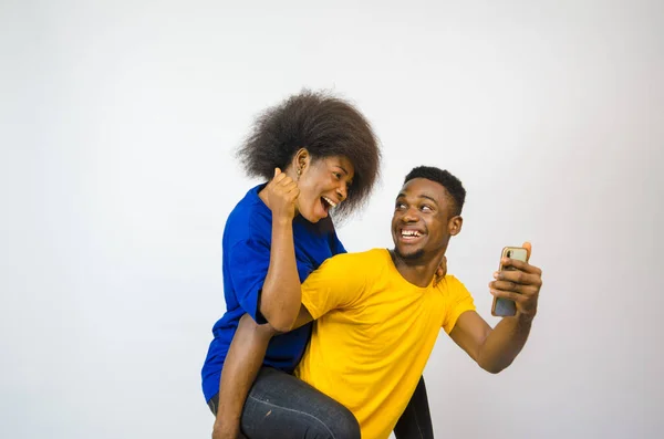 Cute Young African Couple Looking Phone Smiling Boyfriend Carrying His — Stock Photo, Image