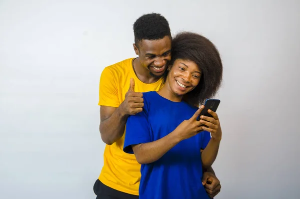 Cute Young African Couple Looking Phone Giving Thumbs Smiling — Stock Photo, Image