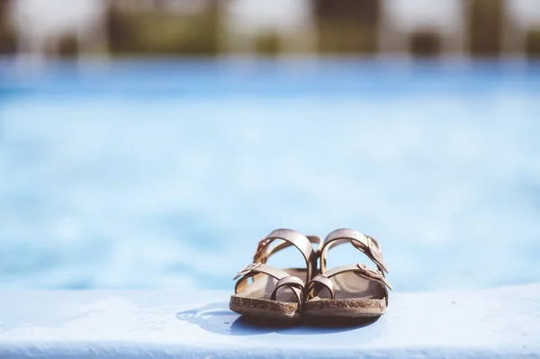 Closeup Focus Shot Leather Sandals Laying Poolside — Stock Photo, Image
