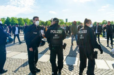 BERLIN, GERMANY - May 01, 2020: BERLIN, GERMANY May 01, 2020. Berlin Demo against Covid 19 with Police. clipart