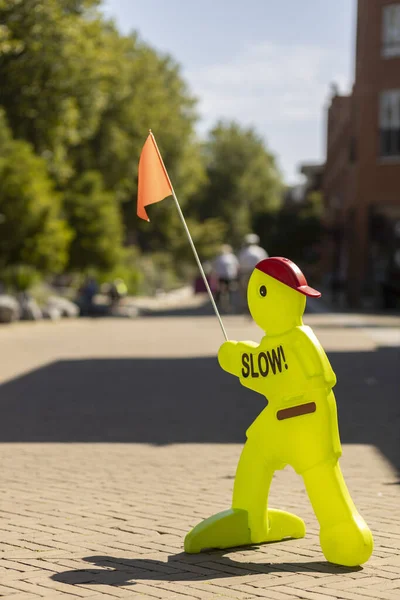 NIJVERDAL, NETHERLANDS - Aug 02, 2020: Dutch traffic sign post urging to slow down for cyclists as it is a pedestrian area in the city centre — Stock Image Nijverdal Netherlands Aug 2020 Dutch Traffic Sign Post Urging Slow Stock Image