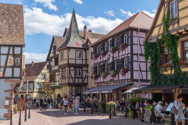 KAYSERSBERG, FRANCE - Aug 08, 2020: Kaysersberg's town center, famous for the good wine and cozy atmosphere. clipart