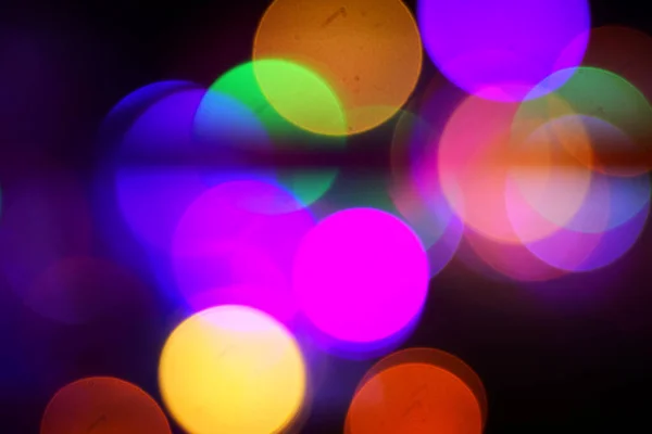 Karanlıkta Renkli Bokeh Işıkları Efektinin Yakın Çekim Görüntüsü — Stok fotoğraf