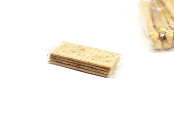 Closeup Crackers Breadsticks Plastic Bags Isolated White Background — Stock Photo, Image