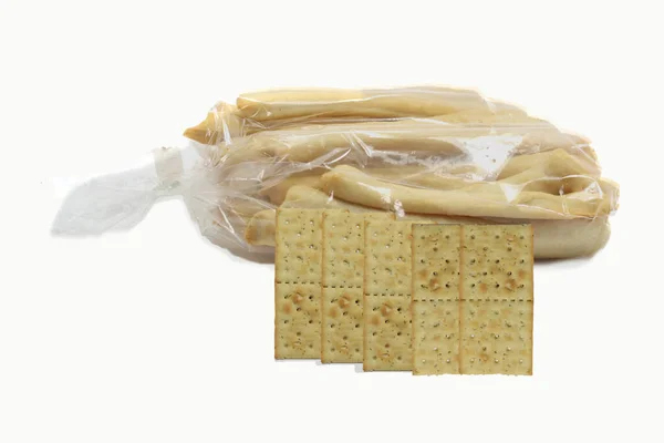 Close Diferentes Biscoitos Sacos Plástico Isolados Fundo Branco — Fotografia de Stock