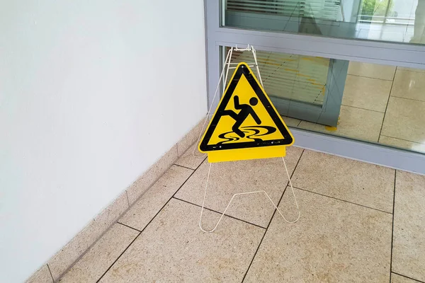 Selective Focus Shot Sleepy Caution Sign Wet Floor — Stock Photo, Image