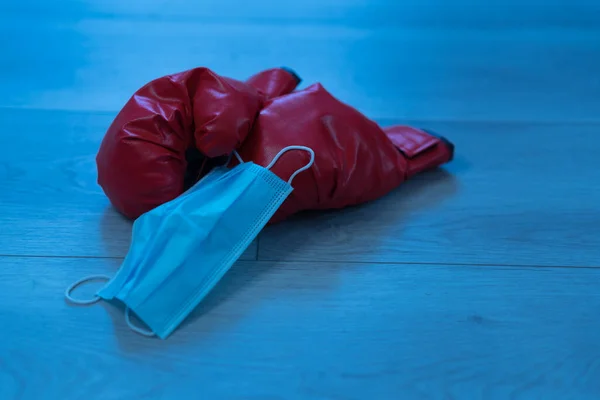 Closeup Pair Red Leather Boxing Gloves Medical Mask Wooden Background — Stock Photo, Image