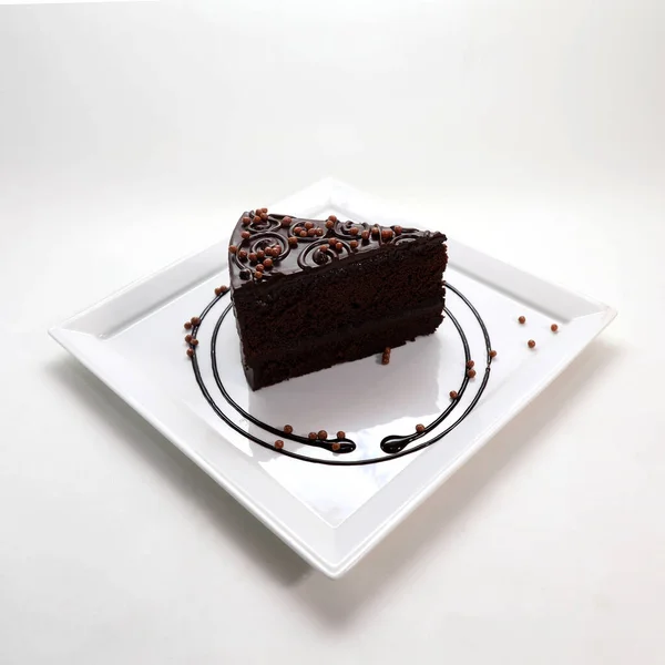 접시에 초콜릿 케이크 조각을 클로즈업 — 스톡 사진