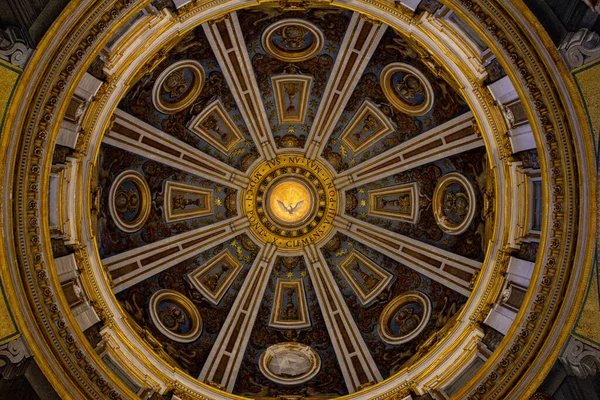 A low angle shot of the ceiling of the St. Peter's Basilica in the Vatican