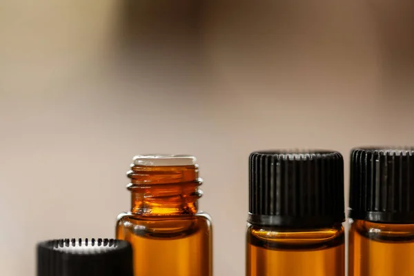 Closeup Small Amber Essential Oil Bottles Table Blurry Background — Stock Photo, Image