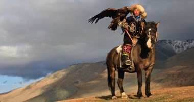 ULGII, MONGOLIA - Sep 29, 2019: Hunting with Eagle is very old and generation cultures of Kazakh Nomads. They lived in Mongolia as Western site. Also they herding the their animals clipart
