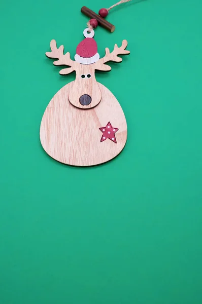 Vertical Shot Deer Shaped Wooden Christmas Ornament Isolated Green Background — Stock Photo, Image