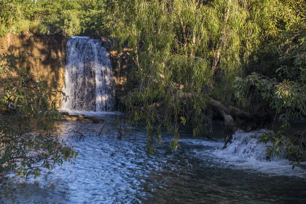 Waterfall Surrounded Cliffs Trees Sunny Day — Stock Photo, Image