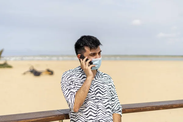 Hispanic Man Wearing Protective Mask While Taking Call Beach Sunny — Stock Photo, Image