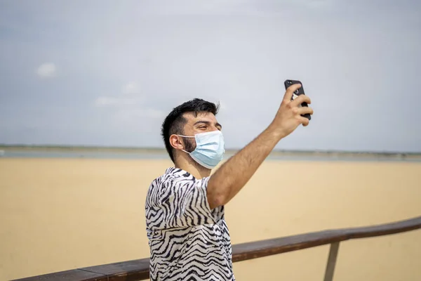 Hispanic Man Wearing Protective Mask Taking Selfie Beach Sunny Day — Stock Photo, Image