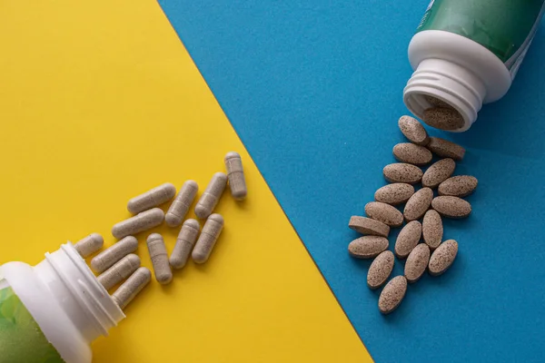 Overhead Shot Containers Pills Blue Yellow Surface — Stock Photo, Image