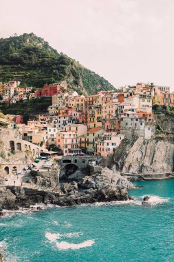 A view of picturesque Manarola town on the seashore, Five Lands, Italy clipart